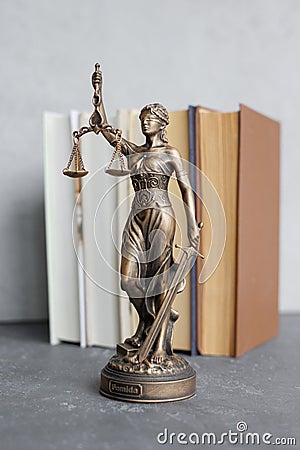 themis goddess of justice statuette, symbol of law with scales and sword in his hands Stock Photo