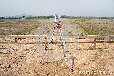 Survey equipment, a theodolite at a construction site. Geodetic total station. Stock Photo