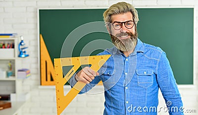 Theorem. Talented teacher. Math subject. Geometry and algebra. Science concept. Mature bearded teacher in glasses Stock Photo