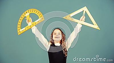 Theorems and axioms. Smart and clever concept. Girl with big ruler. School student study geometry. Kid school uniform Stock Photo