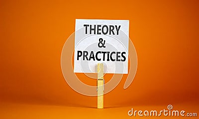 Theory and practice symbol. White paper with words `Theory and practice`, clip on wooden clothespin. Beautiful orange background Stock Photo