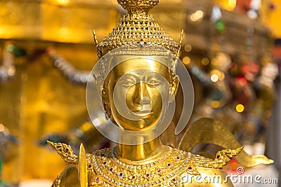 Theppaksi Gold statue. Asian art close up Stock Photo