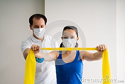 Therapist Doing Band Resistance Shoulder Physical Stock Photo