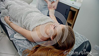 A therapist massaging hands of a woman Stock Photo