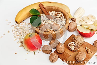 There are Banana,Apple,Walnuts in the Wooden Plate an Stock Photo