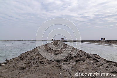 There are farms and roads made of soil on the dark beach Stock Photo