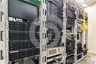 There is a lot of telecommunications equipment in the server room. Powerful computing hardware works in the data center racks. Stock Photo