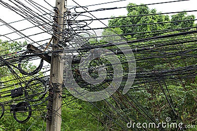 Multiple wires on concrete pole. Stock Photo