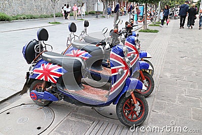 There are many brightly colored electric bicycles on the streets of Dali Editorial Stock Photo