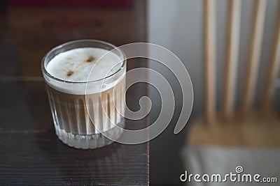 There is a nice latte on the brown wooden table Stock Photo