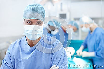 There is no medicine like hope. Portrait of confident surgeon wearing hospital scrubs in an operating room. Stock Photo