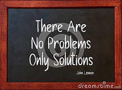 There are no problems only solutions. Motivational Quote by John Lennon on blackboard Editorial Stock Photo