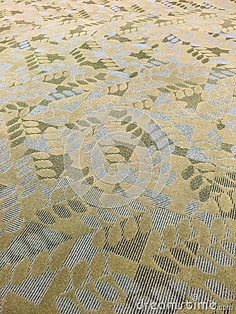 Contemporary textured gold, white and green carpeting. Stock Photo