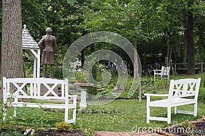 There are two benches in this quaint little park. Stock Photo