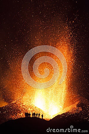 People watching explosive eruptions are characterized by gas-driven explosions that propels magma and tephra. Stock Photo