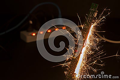 There was a spark on the circuit board. The concept of using appliances that is substandard is therefore dangerous and dangerous Stock Photo
