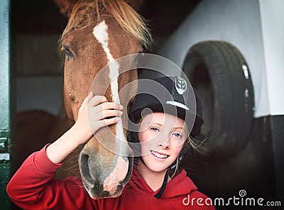 Theres a lot to love about a horse. a teenage girl bonding with her horse. Stock Photo