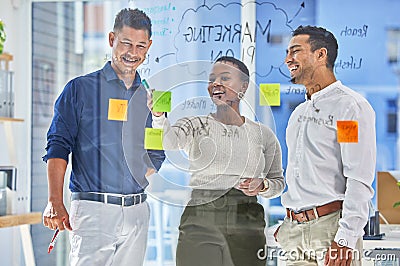 Theres always a workaround solution. three coworkers brainstorming in a modern office. Stock Photo