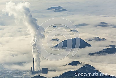 Thermal power plant in foggy landscape Stock Photo