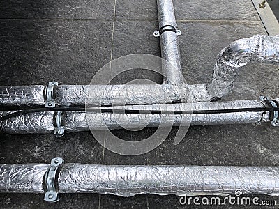 Thermally insulated water pipes on the pipeline Stock Photo