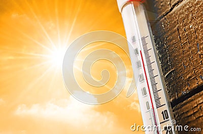 Thermometer is hot in the sky, concept of hot weather. Stock Photo