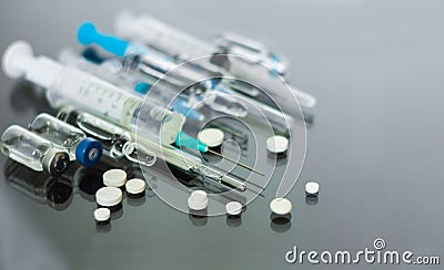Thermometer, pills, injection vaccine ampoules, syringe for vaccination on glass background, Coronavirus, MERS-CoV, air Stock Photo