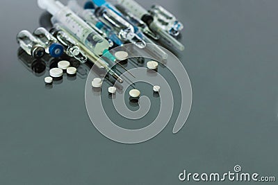 Thermometer, pills, injection vaccine ampoules, syringe for vaccination on glass background, Coronavirus, MERS-CoV, air Stock Photo