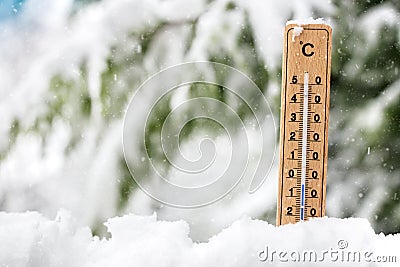 Thermometer showing freezing cold temperature in the snow Stock Photo