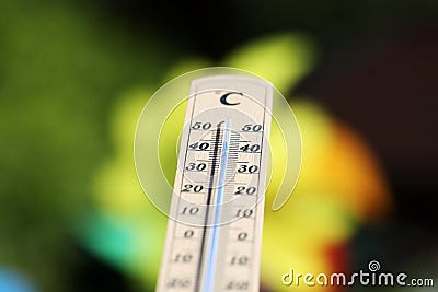Thermometer shows high temperatures on a hot summer day Stock Photo