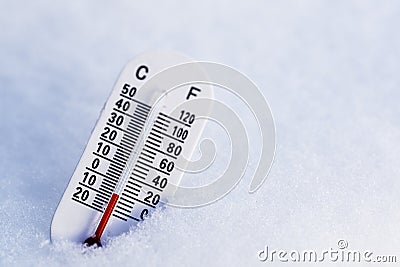 Thermometer in the snow Stock Photo