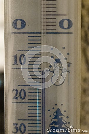 Thermometer snow showing sub-zero temperature 11 degree at night Stock Photo