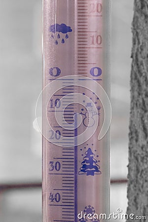 Thermometer snow showing sub-zero temperature 10 degree at night Stock Photo