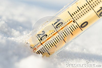 Thermometer on snow shows low temperatures in celsius Stock Photo