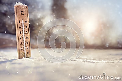 Thermometer in the snow Stock Photo