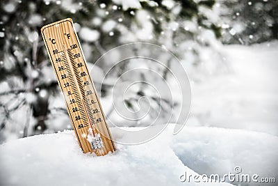 Thermometer with sub-zero temperatures sticking out Stock Photo