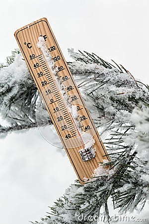 Thermometer with subzero temperature stuck in the snow Stock Photo