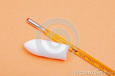 Thermometer and suppository medication on orange. Rectal drug administration. Stock Photo
