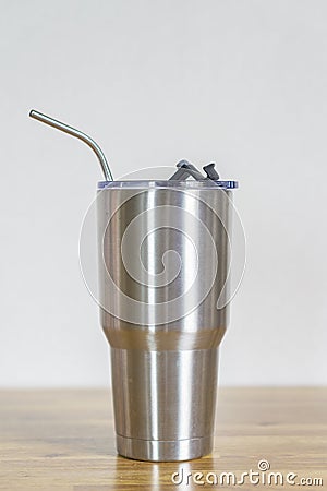 Thermos tumbler mug that made of stainless steel with metal drinking straws Stock Photo