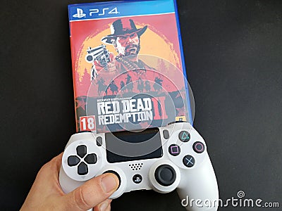 Thessaloniki, Greece, February 11, 2020: The New Red Dead Redemption 2 game with ps4 v2 white Joystick on black Editorial Stock Photo