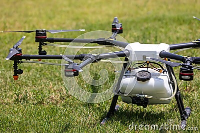 Professional agriculture drone on the green field during pre-fli Editorial Stock Photo