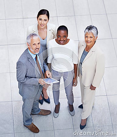 Theyre a force to be reckoned with. HIgh angle portrait of a diverse and confident group of businesspeople standing with Stock Photo