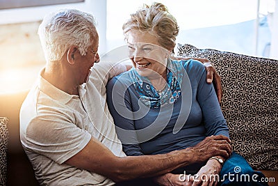 Theyre proof that true love does exist. a senior couple relaxing together on the sofa at home. Stock Photo