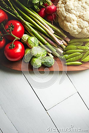 Theyre vital for your health. a variety of fresh produce on a wooden chopping board. Stock Photo