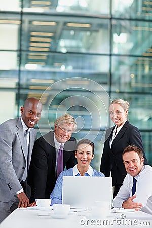 Theyve had a great financial year. Positive team of business associates working together. Stock Photo