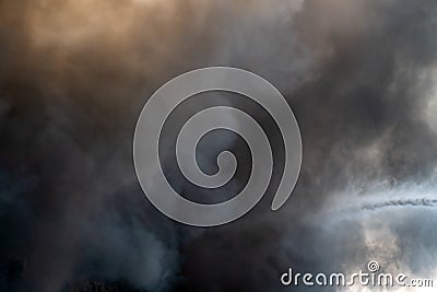 Thick black acrid smoke on the sky background Stock Photo