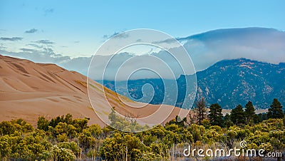 Thick Clouds over the Sangre de Cristo Mountains Great Sand Dune Stock Photo