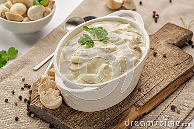 Thick creamy sauce with mushrooms Stock Photo