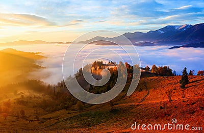 Thick fog, covered the valley, behind which rise mountain hills. Stock Photo