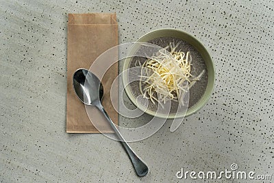 Thick mushroom cream soup with grated cheese. Stock Photo