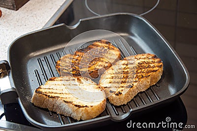 Thick slices of freshly baked garlic bread seasoned Stock Photo